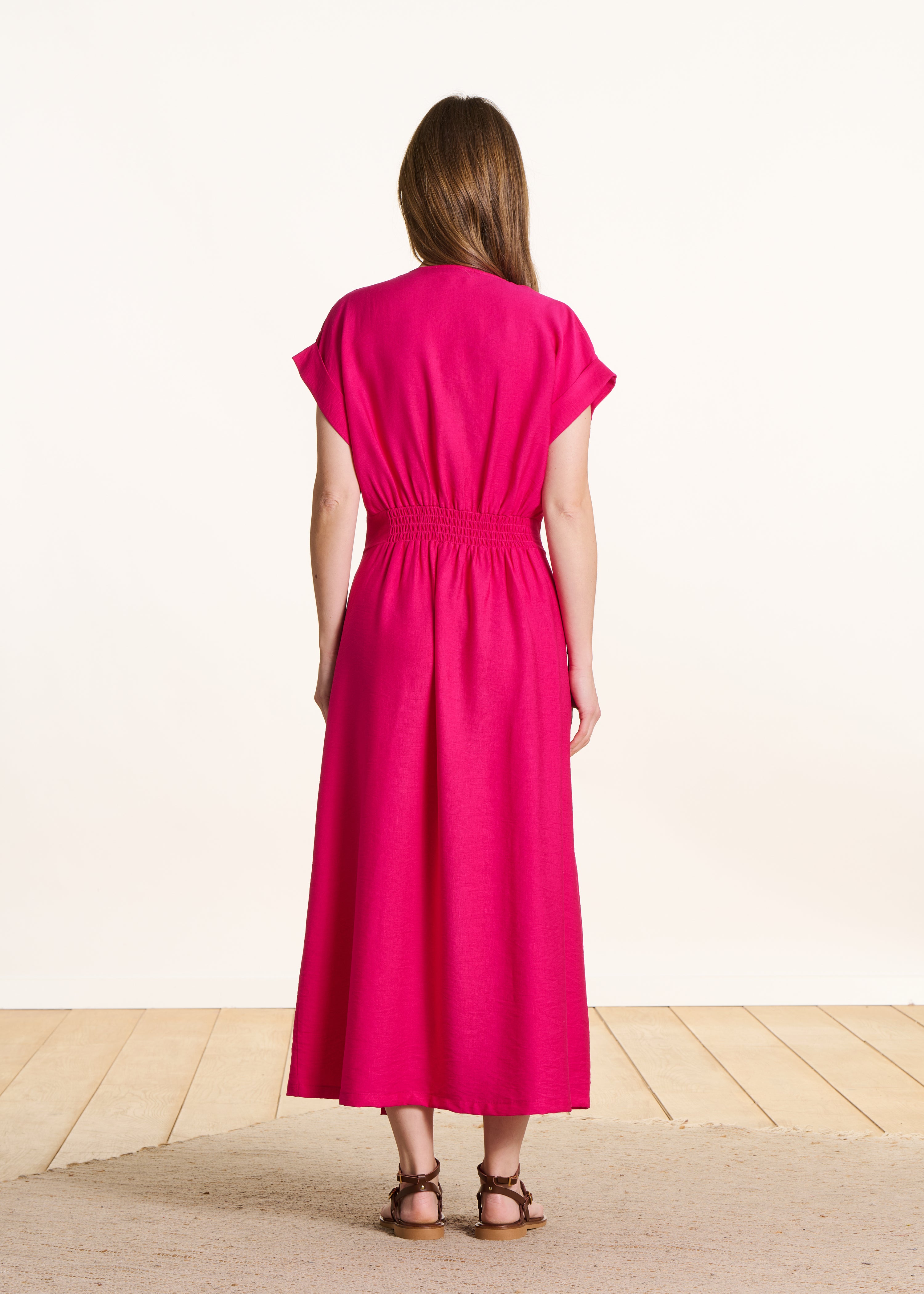 Robe longue cintrée rose fuchsia cache-cœur