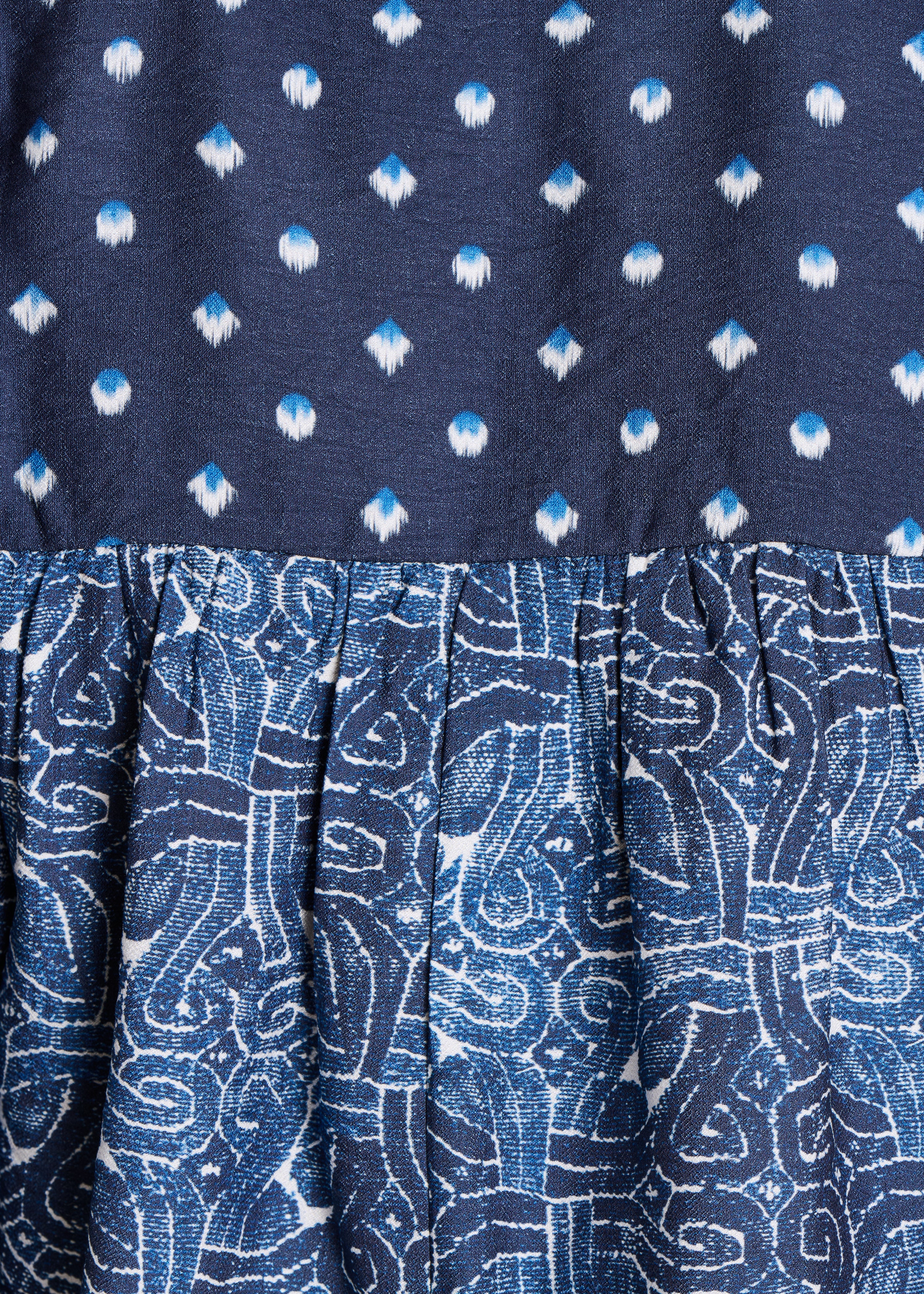 Blauwe top met patchworkprint en 3/4 mouwen