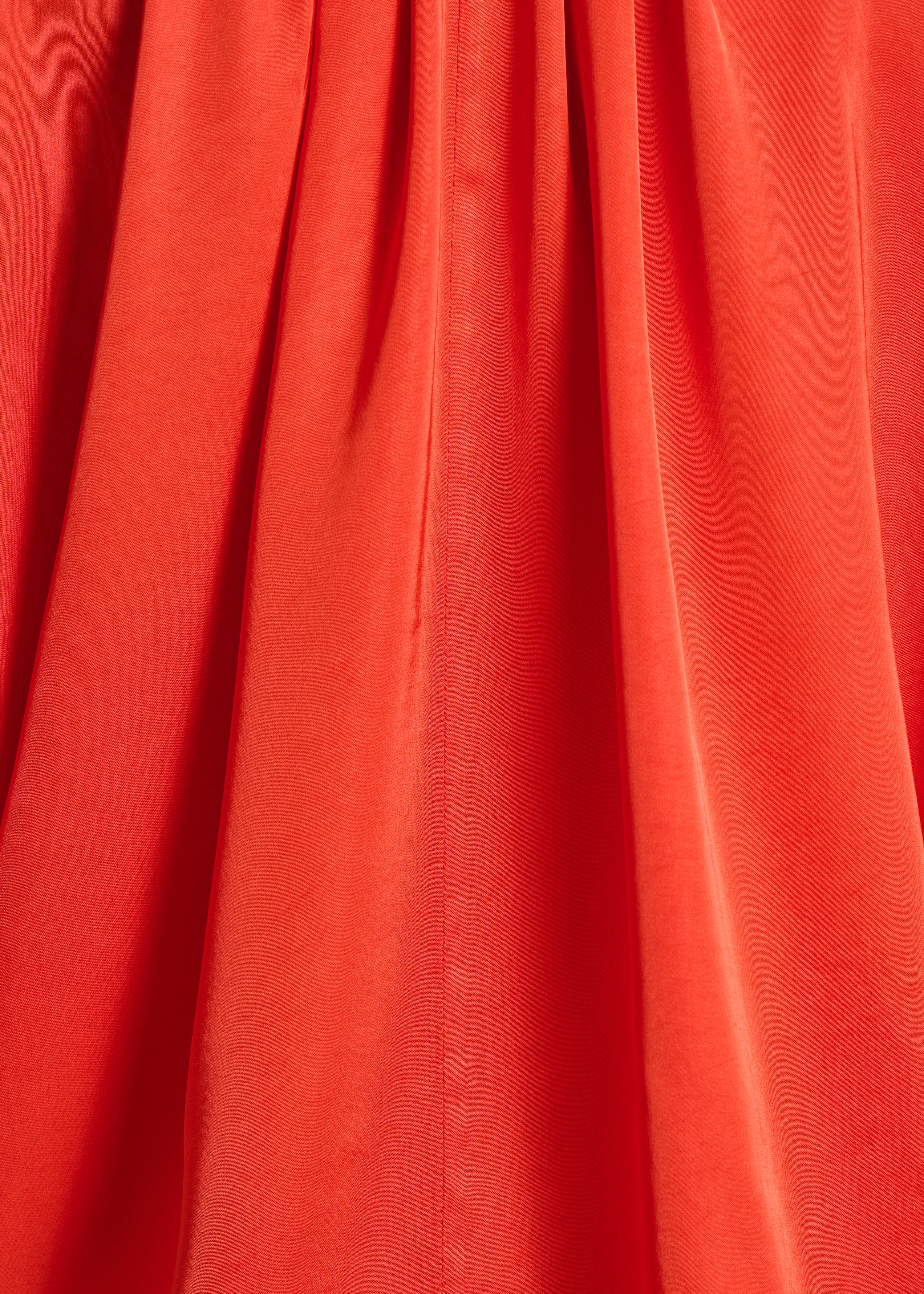 Blusa naranja amplia con escote tunecino