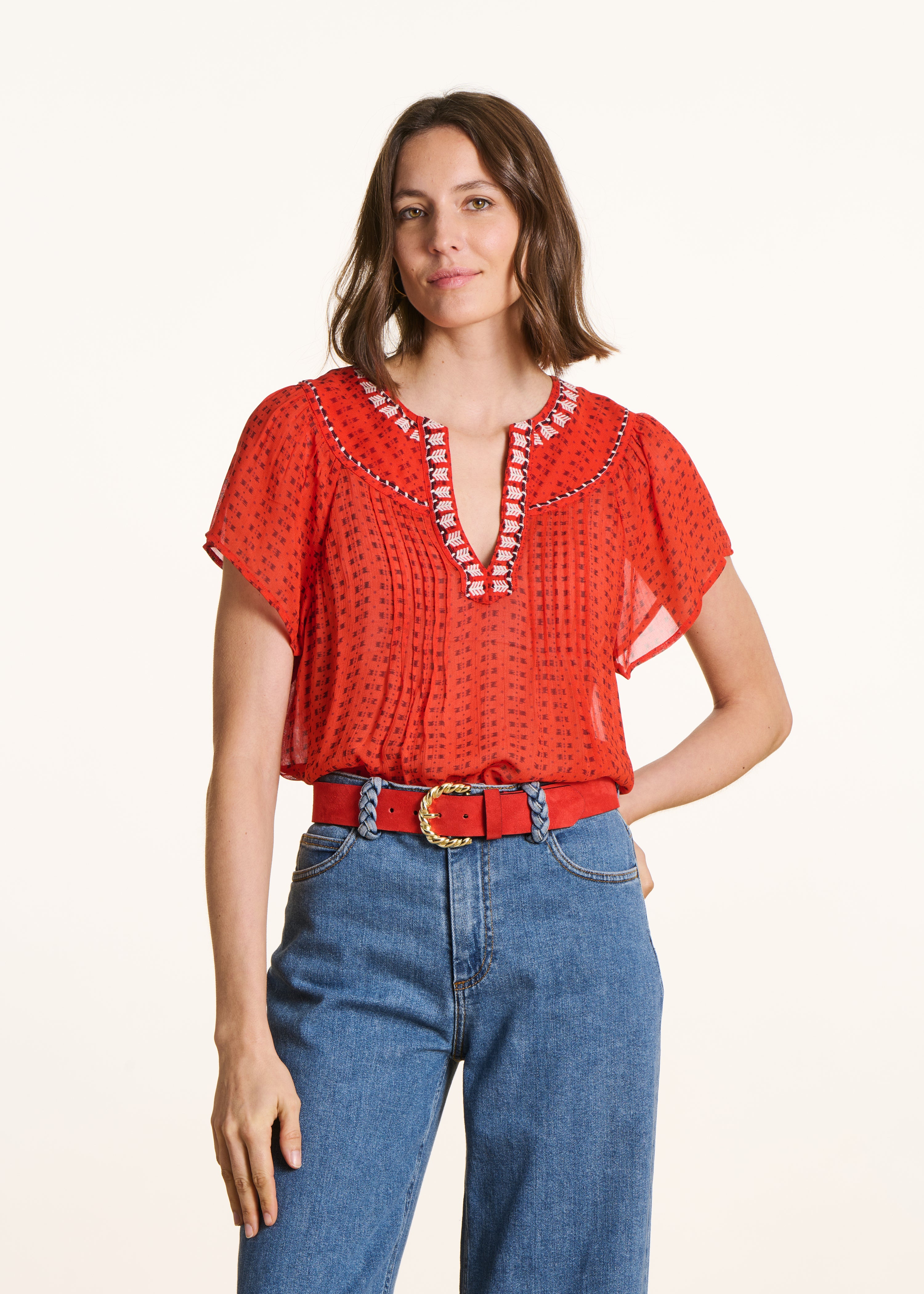 Loose red blouse with graphic print