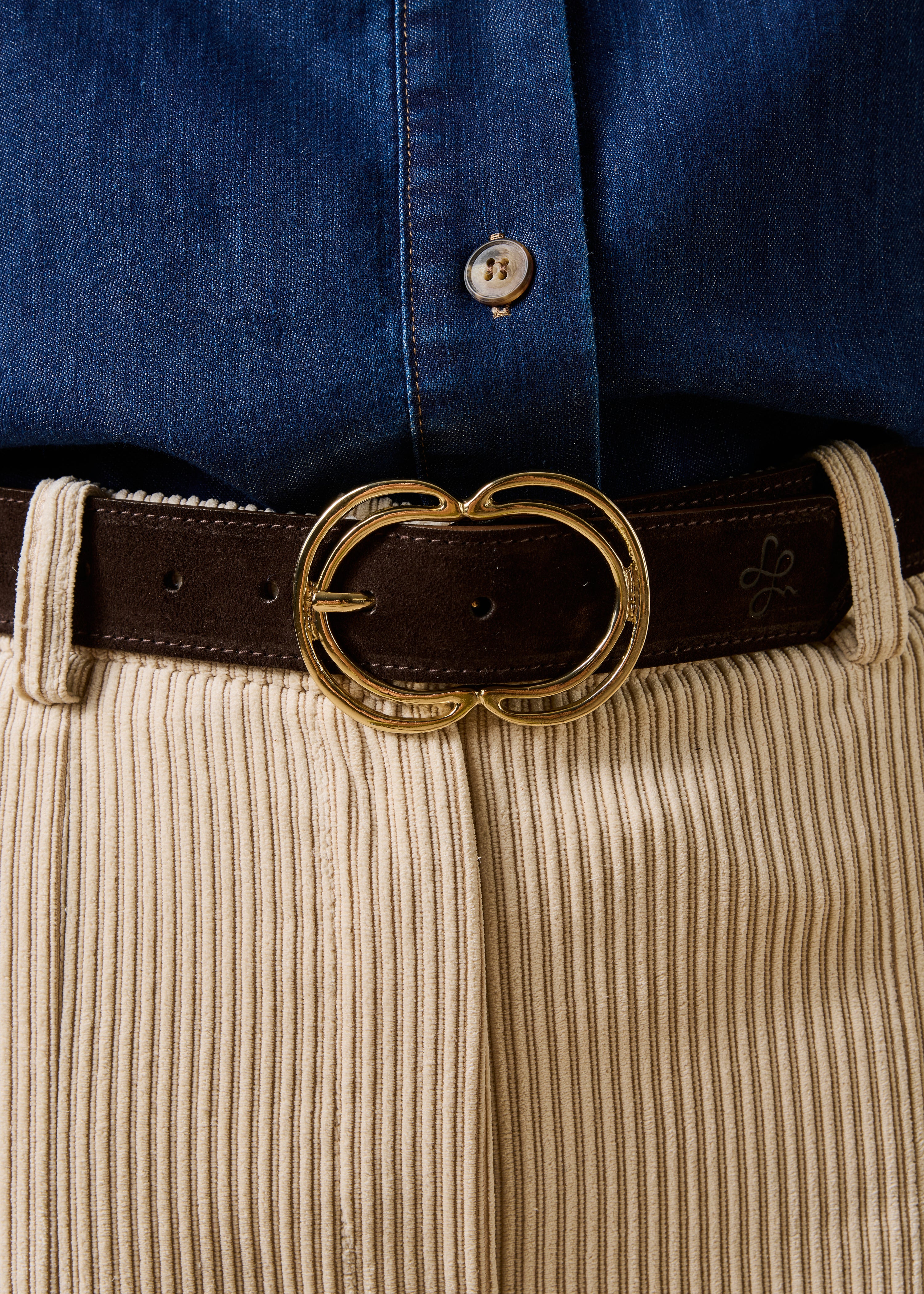 Brown belt with golden oval buckle