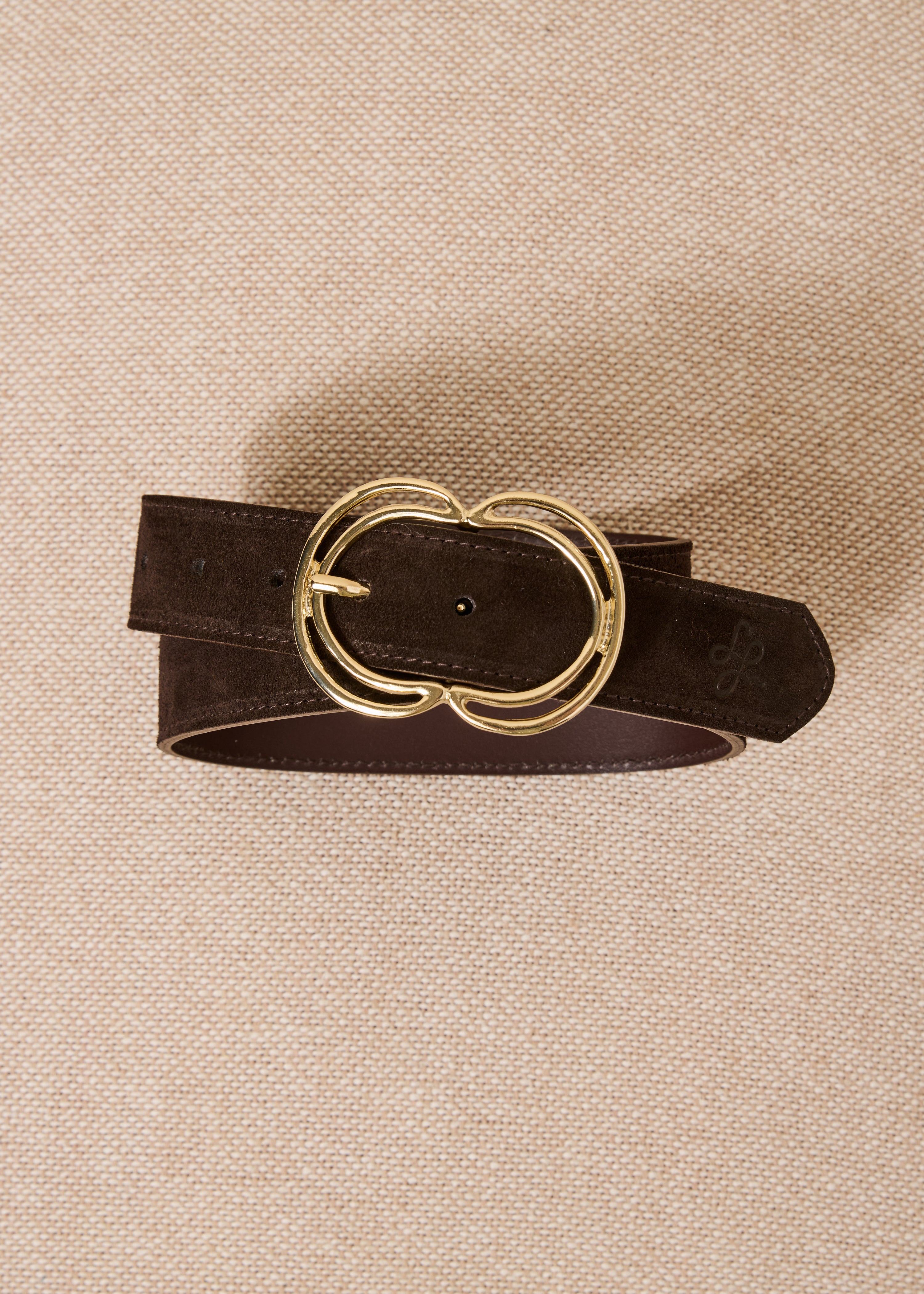 Brown belt with golden oval buckle