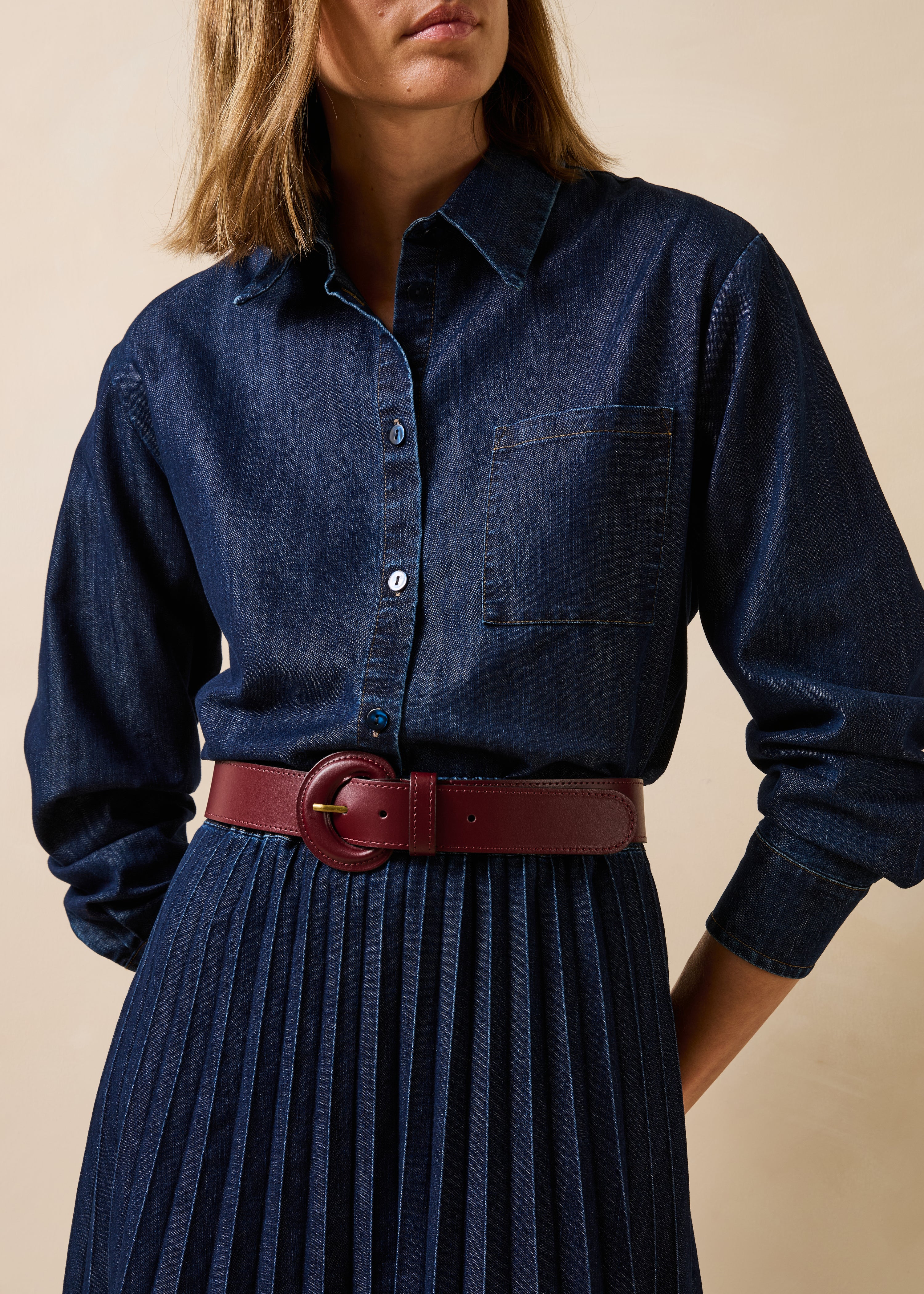 Burgundy leather belt with round buckle