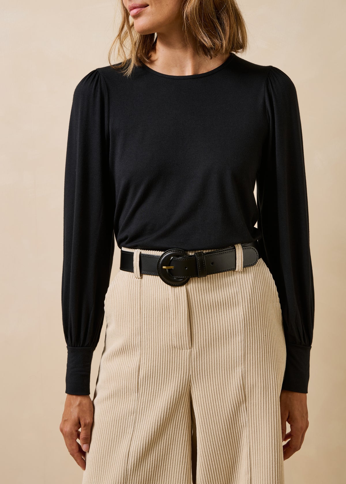 Black leather belt with round buckle