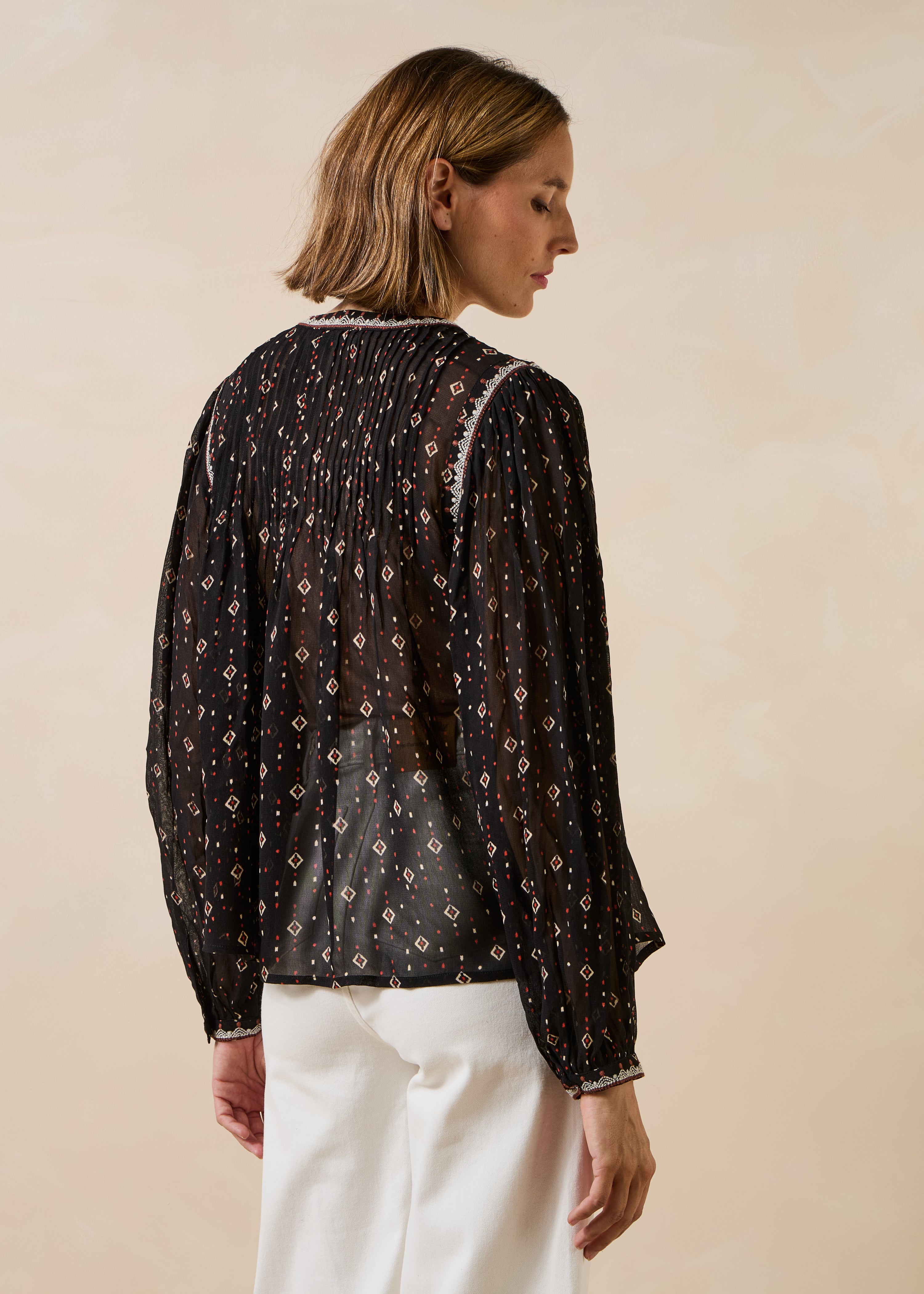 Schwarze Bluse mit langen Ärmeln und Print
