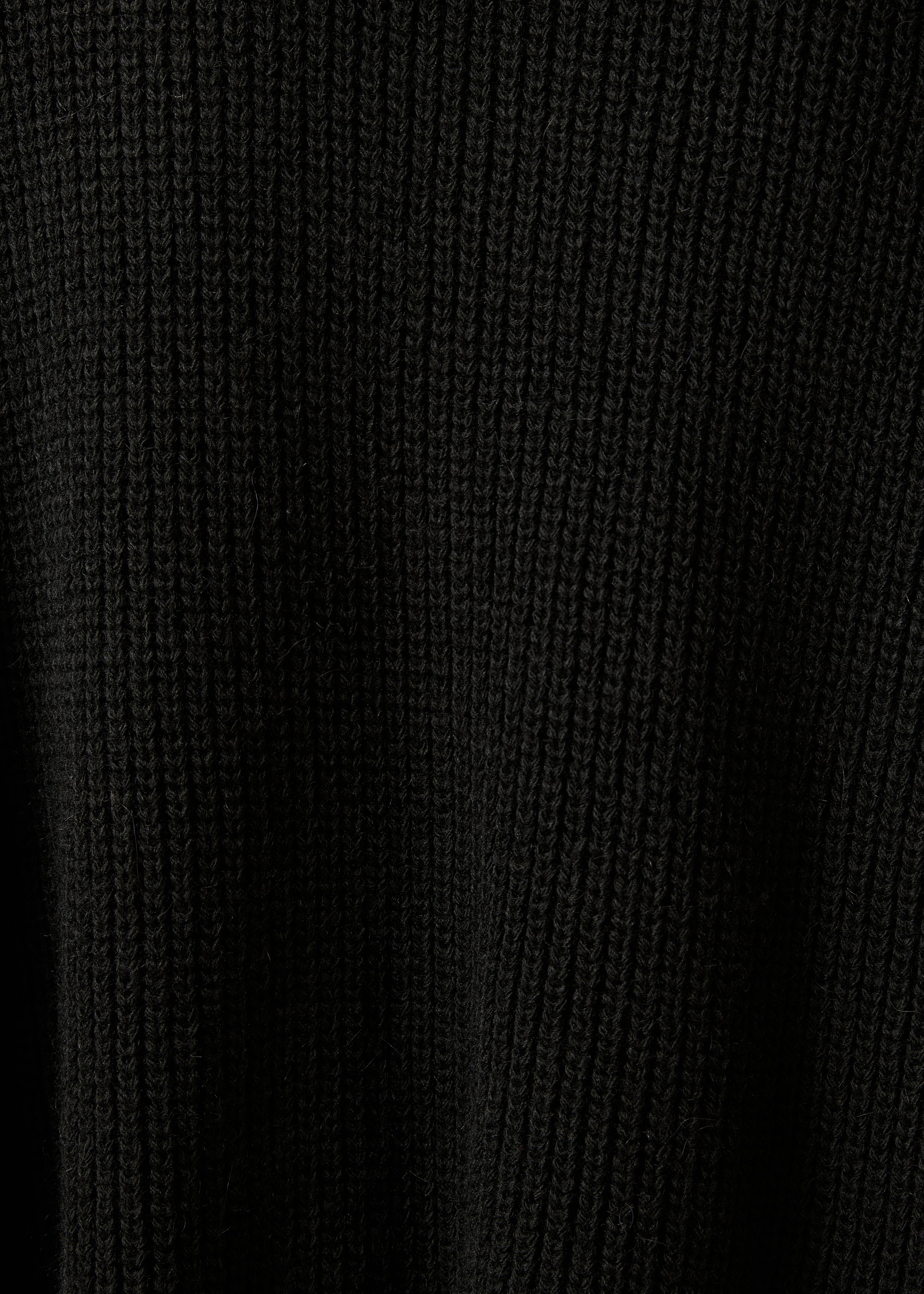 Chaleco negro de manga corta con cuello redondo