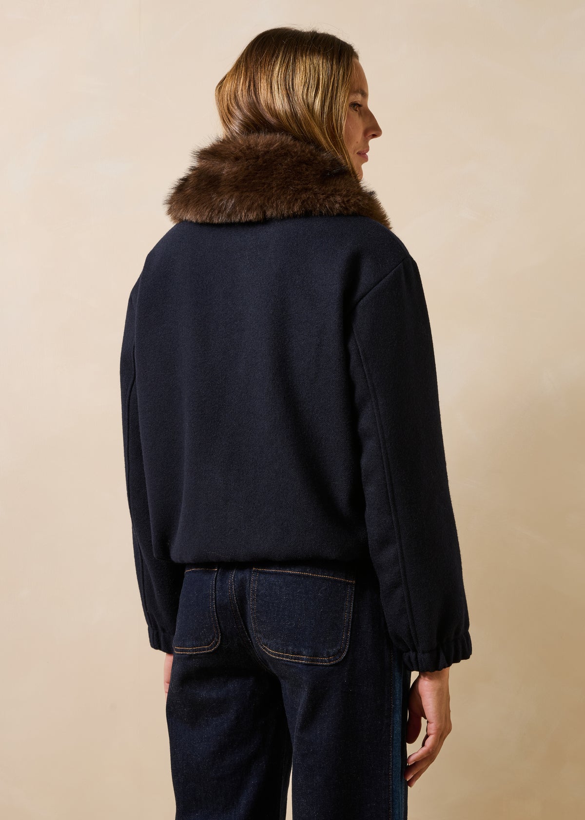 Navy blue jacket with faux fur collar
