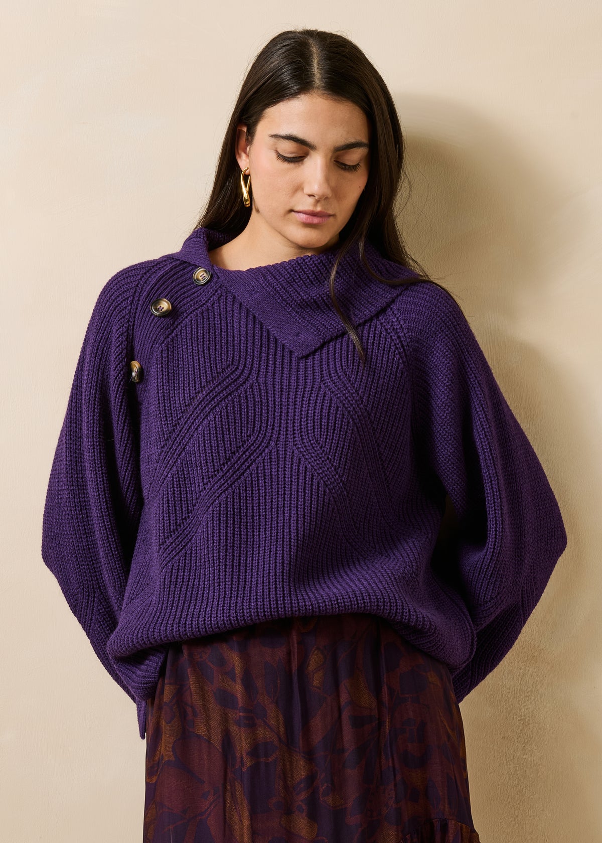 Plum-colored long-sleeve sweater with asymmetrical collar
