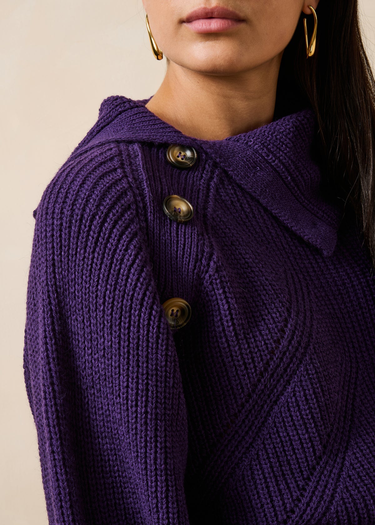 Plum-colored long-sleeve sweater with asymmetrical collar
