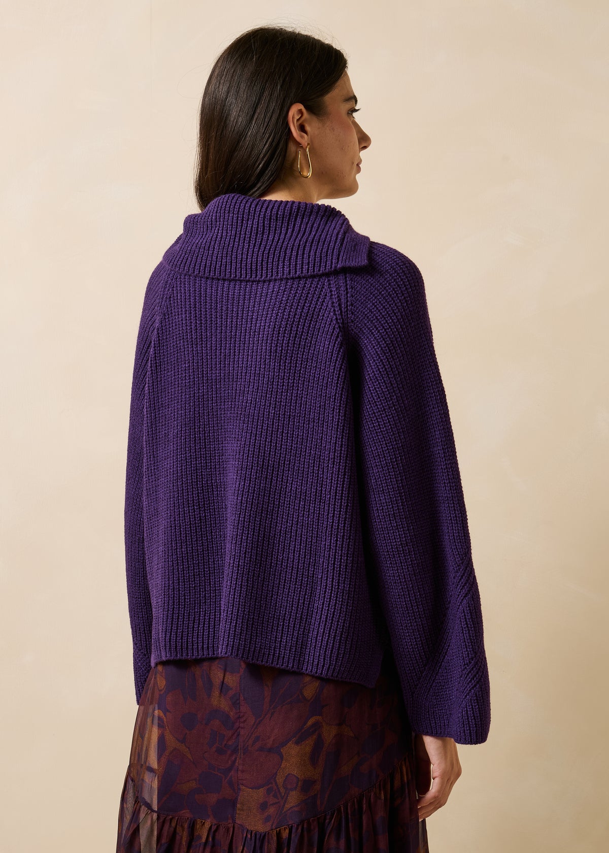 Plum-colored long-sleeve sweater with asymmetrical collar